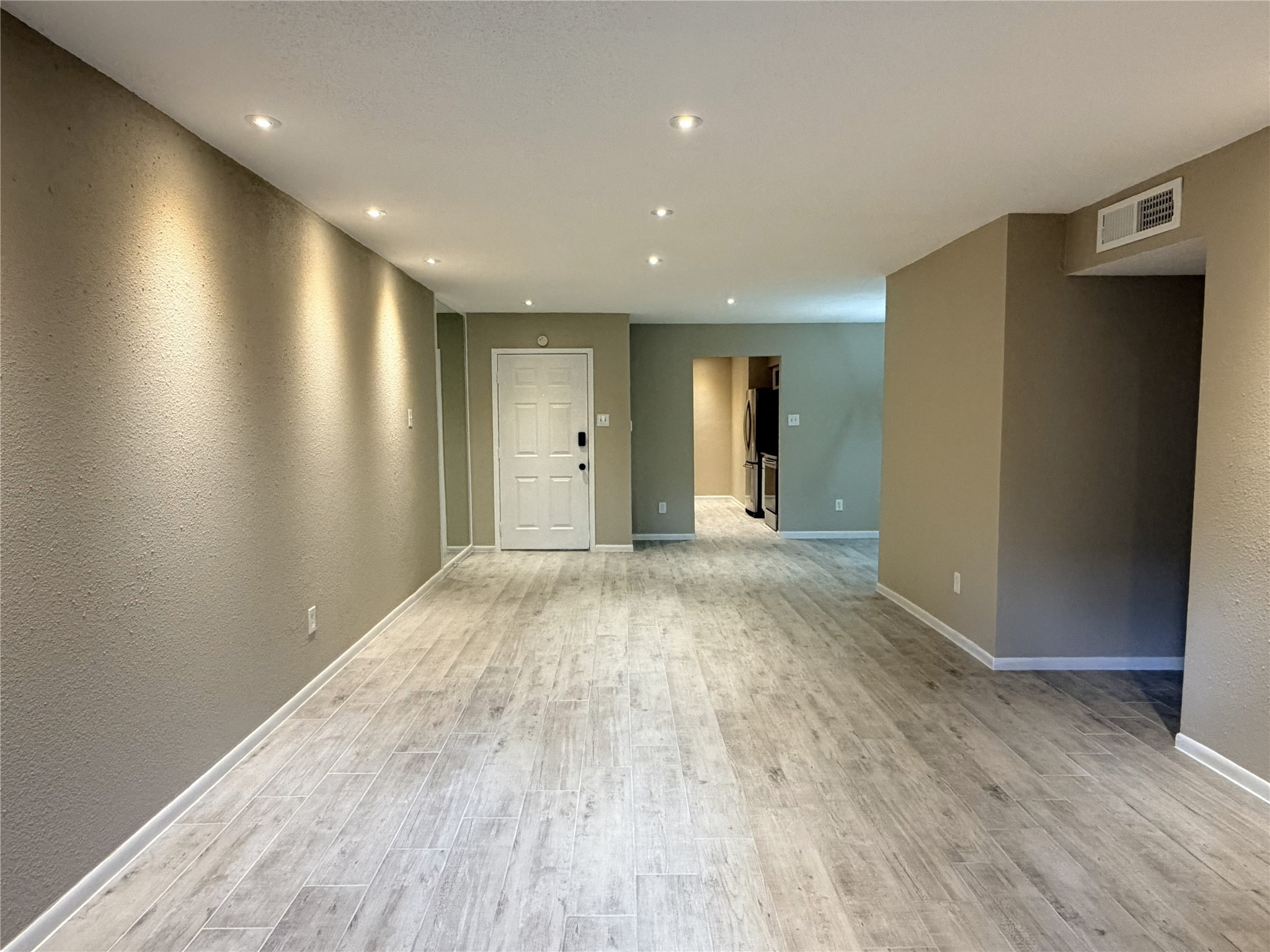 2800 Jeanetta Street, Unit 2813 Houston, TX 77063 - Photo 2 of 28 a view of livingroom with an empty space and a window