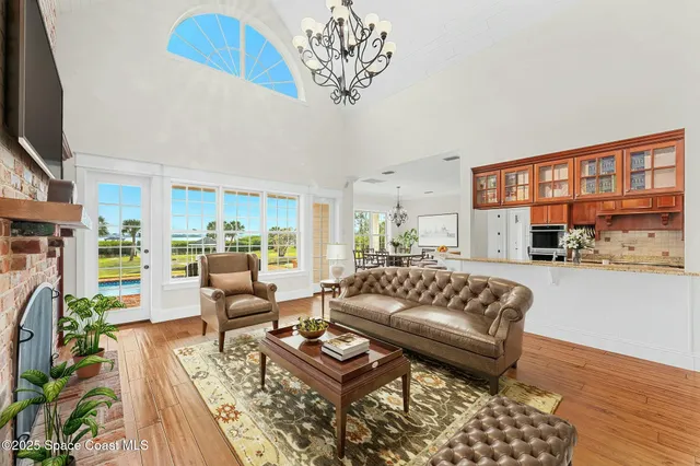 a living room with furniture a window and a fireplace