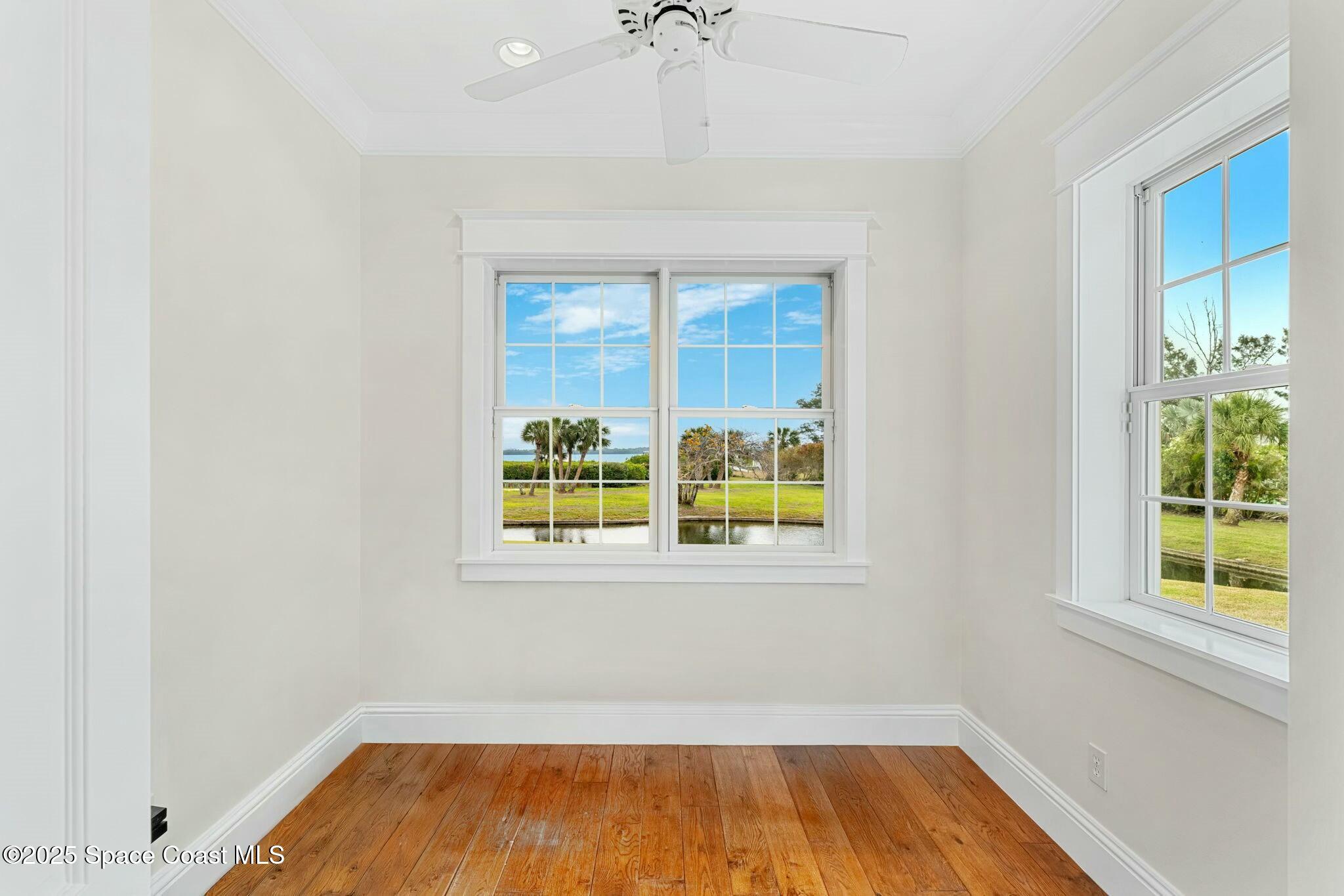 9490 South Tropical Trail Merritt Island, FL 32952 - Photo 39 of 63 an empty room with windows