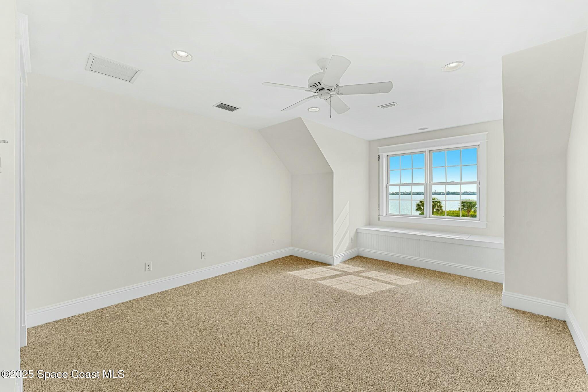 9490 South Tropical Trail Merritt Island, FL 32952 - Photo 40 of 63 a view of an empty room with a window