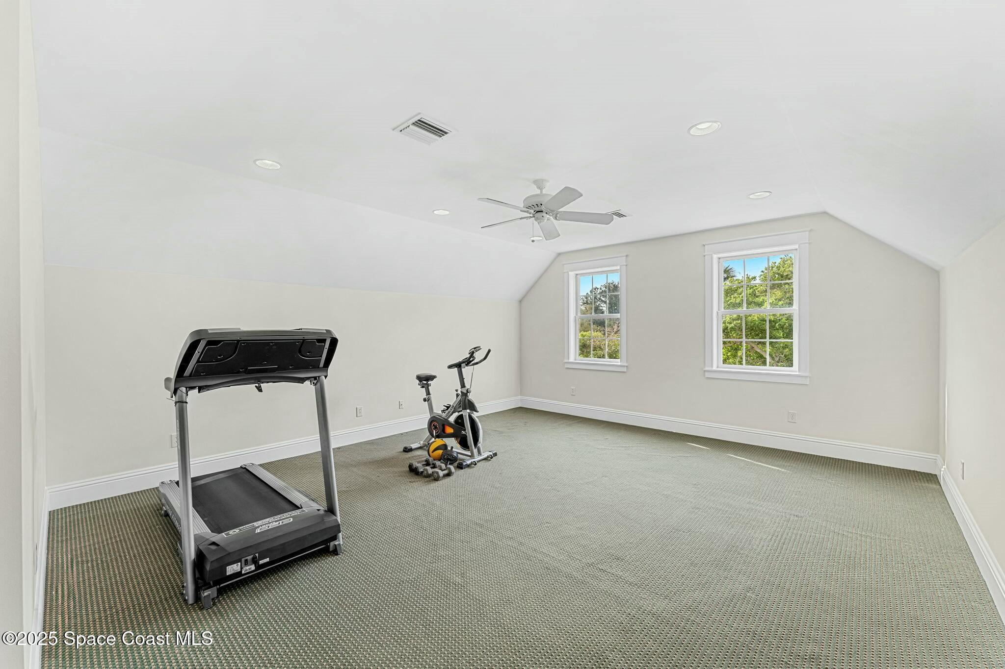 9490 South Tropical Trail Merritt Island, FL 32952 - Photo 41 of 63 an empty room with windows