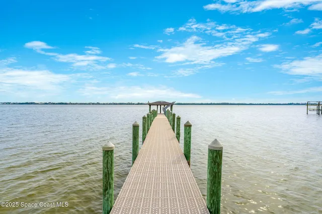 a view of a swimming pool with an ocean view