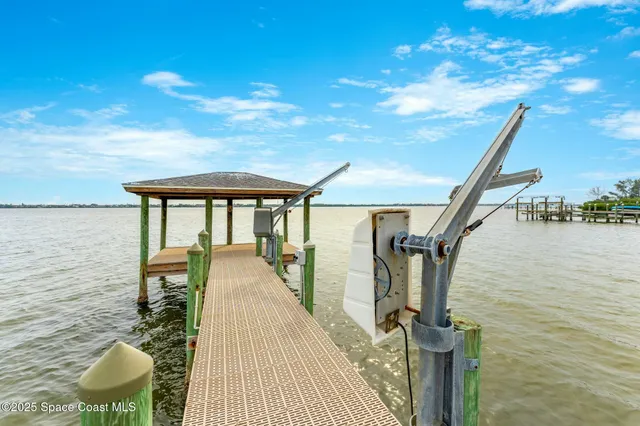 a view of a house with a backyard and a garage
