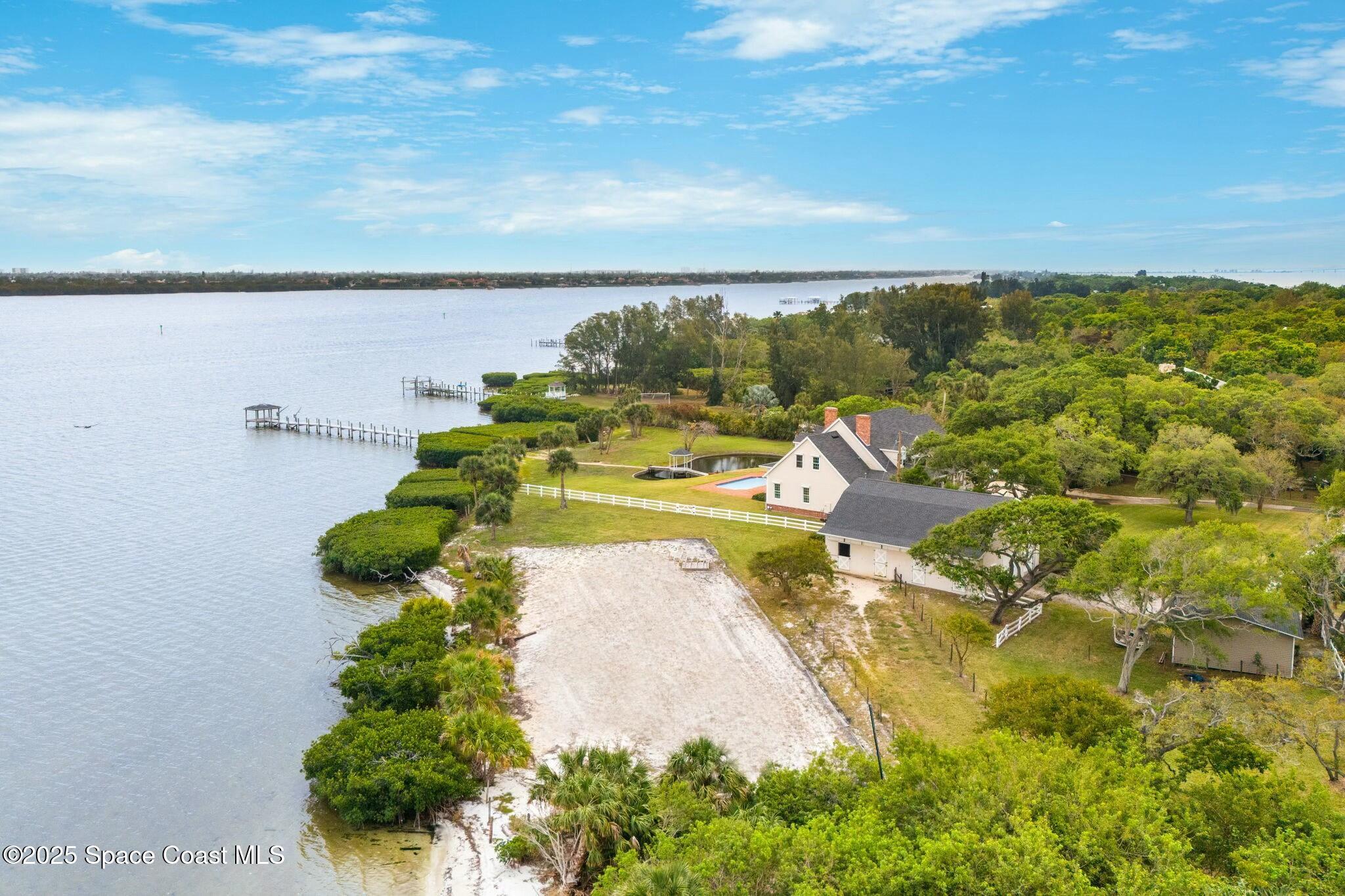 9490 South Tropical Trail Merritt Island, FL 32952 - Photo 63 of 63 a view of a lake with a houses