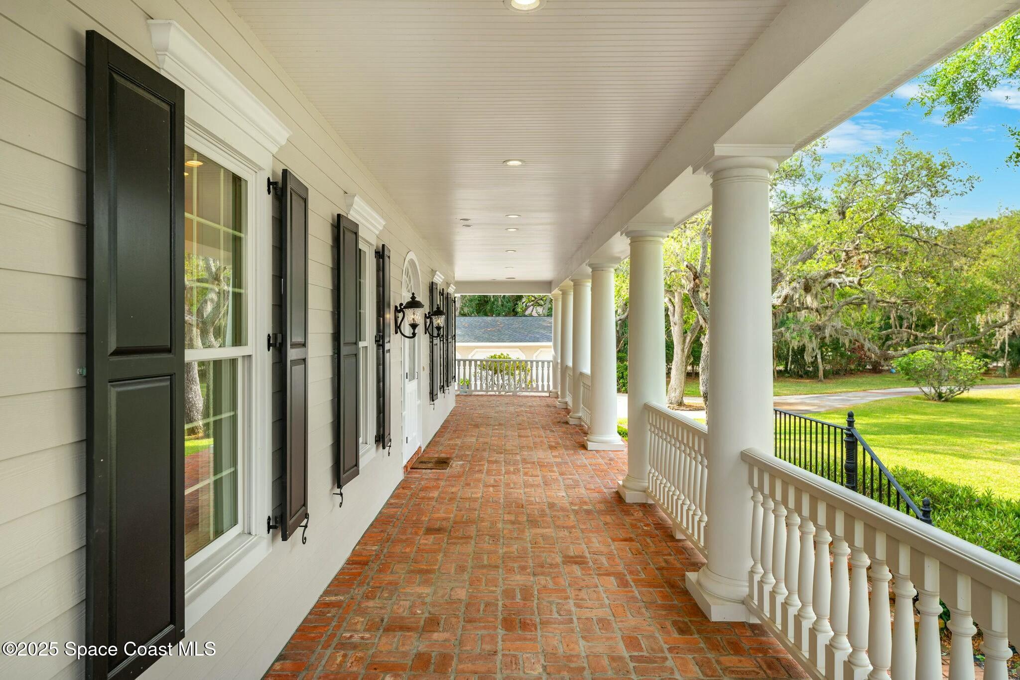 9490 South Tropical Trail Merritt Island, FL 32952 - Photo 8 of 63 a view of a porch