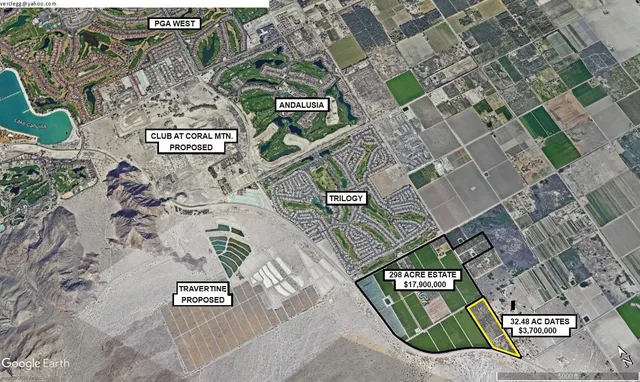 an aerial view of a residential apartment building with a yard