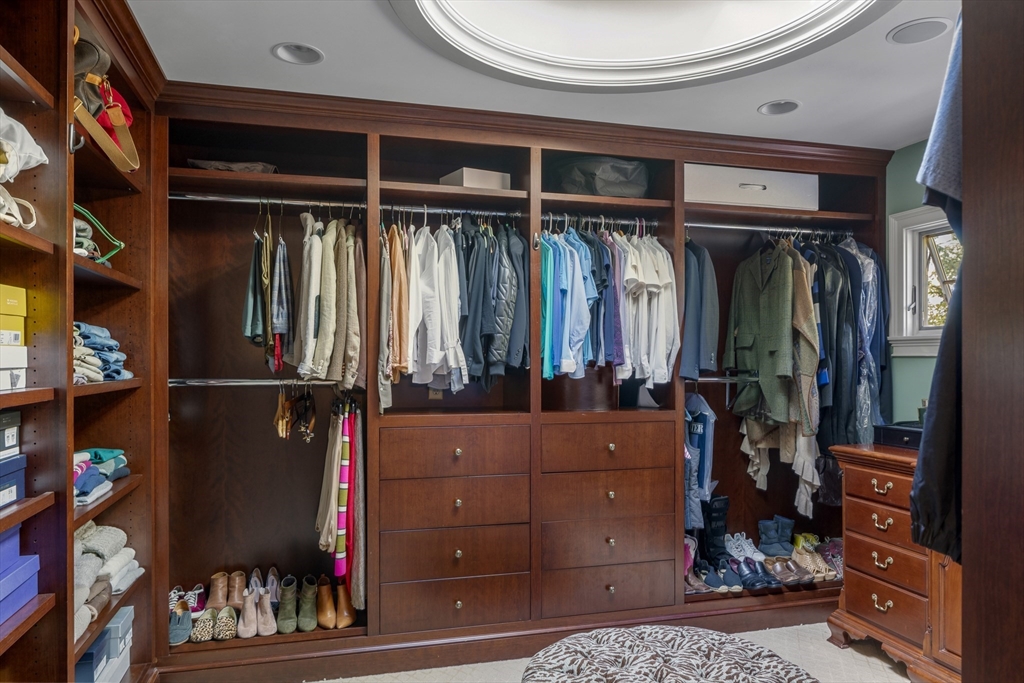 98 Valley Road Boxford, MA 01921 - Photo 20 of 40 a view of walk in closet with clothes and shoes