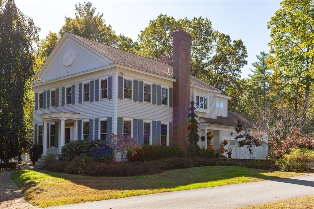 98 Valley Road Boxford, MA 01921 - Photo 2 of 40 a front view of a house with a garden