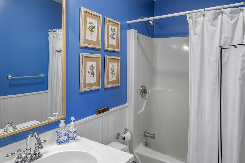 98 Valley Road Boxford, MA 01921 - Photo 26 of 40 a bathroom with a bathtub and a shower
