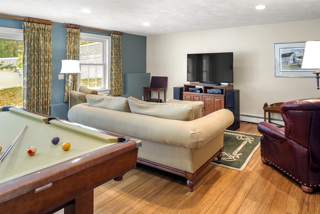 98 Valley Road Boxford, MA 01921 - Photo 27 of 40 a living room with furniture and a flat screen tv
