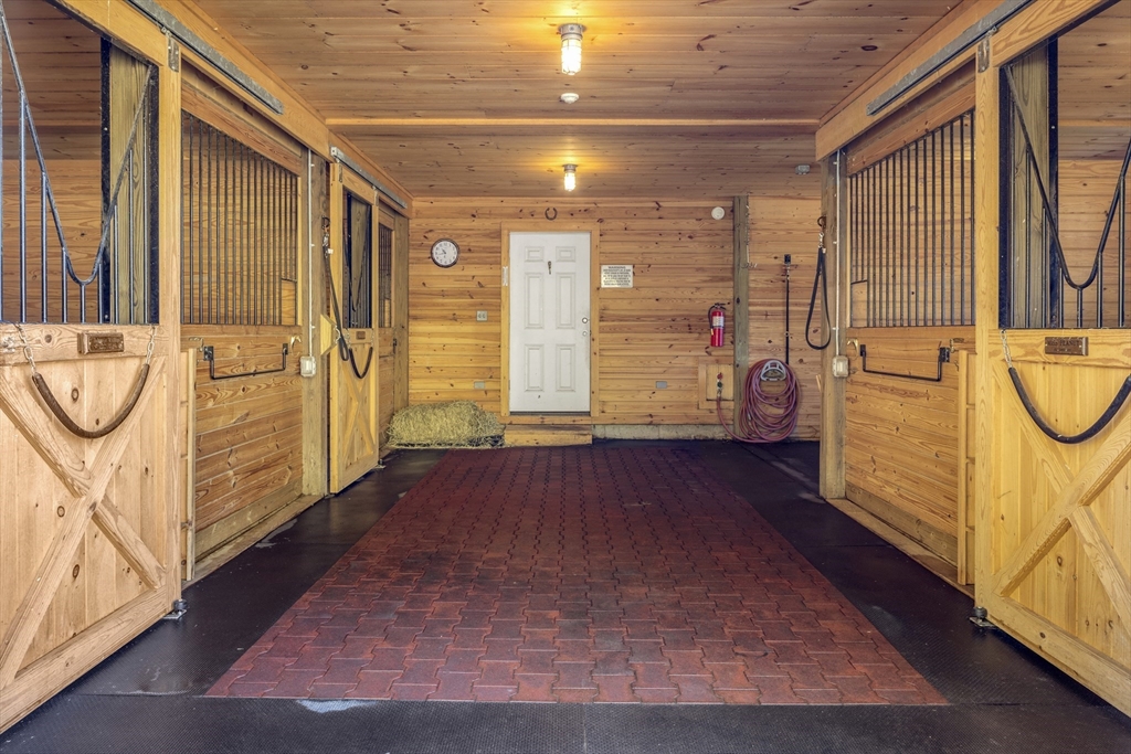98 Valley Road Boxford, MA 01921 - Photo 30 of 40 a view of empty room with wooden floor and fan