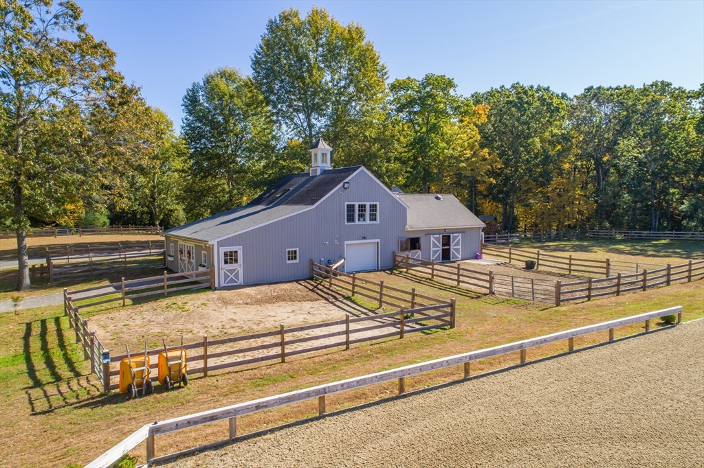 98 Valley Road Boxford, MA 01921 - Photo 33 of 40 a view of a house with wooden fence
