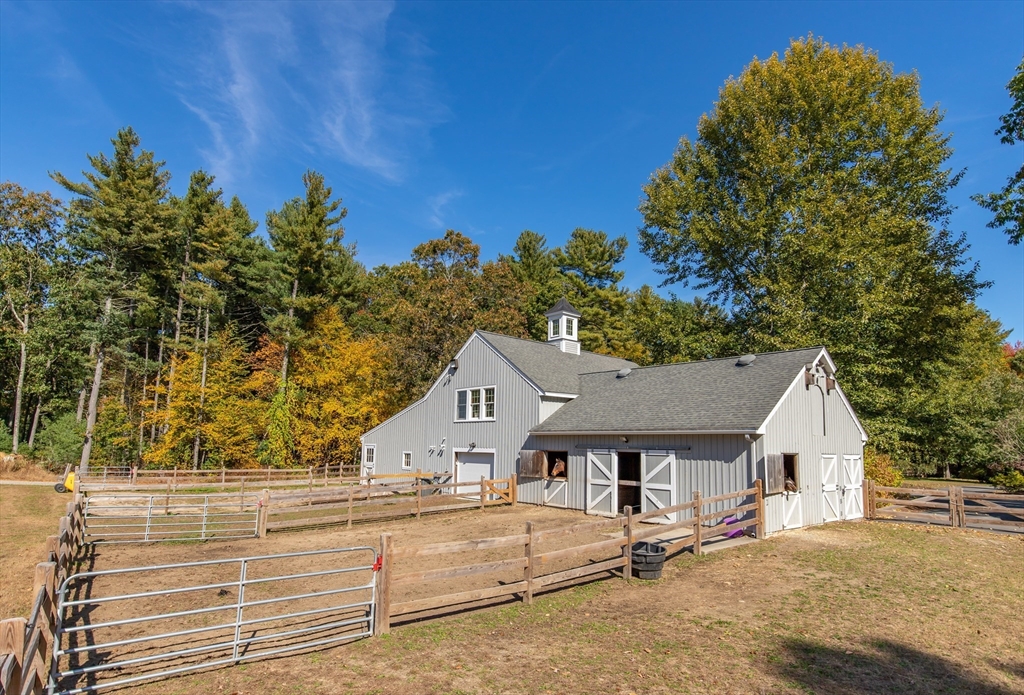 98 Valley Road Boxford, MA 01921 - Photo 35 of 40 a house with trees in the background