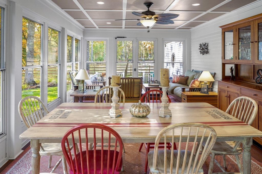 98 Valley Road Boxford, MA 01921 - Photo 8 of 40 a view of a dining room with furniture a chandelier and wooden floor