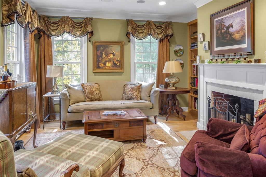 98 Valley Road Boxford, MA 01921 - Photo 10 of 40 a living room with furniture a fireplace and a large window