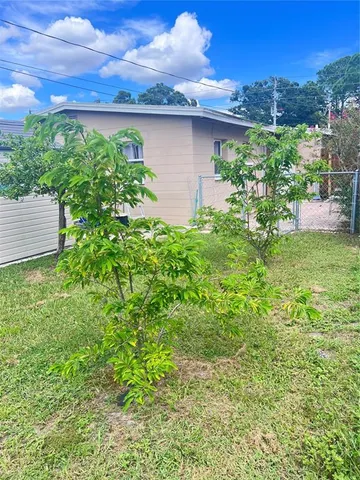 a backyard of a house with lots of green space
