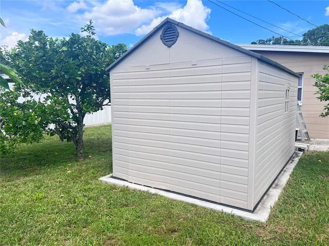 a view of a back yard of the house