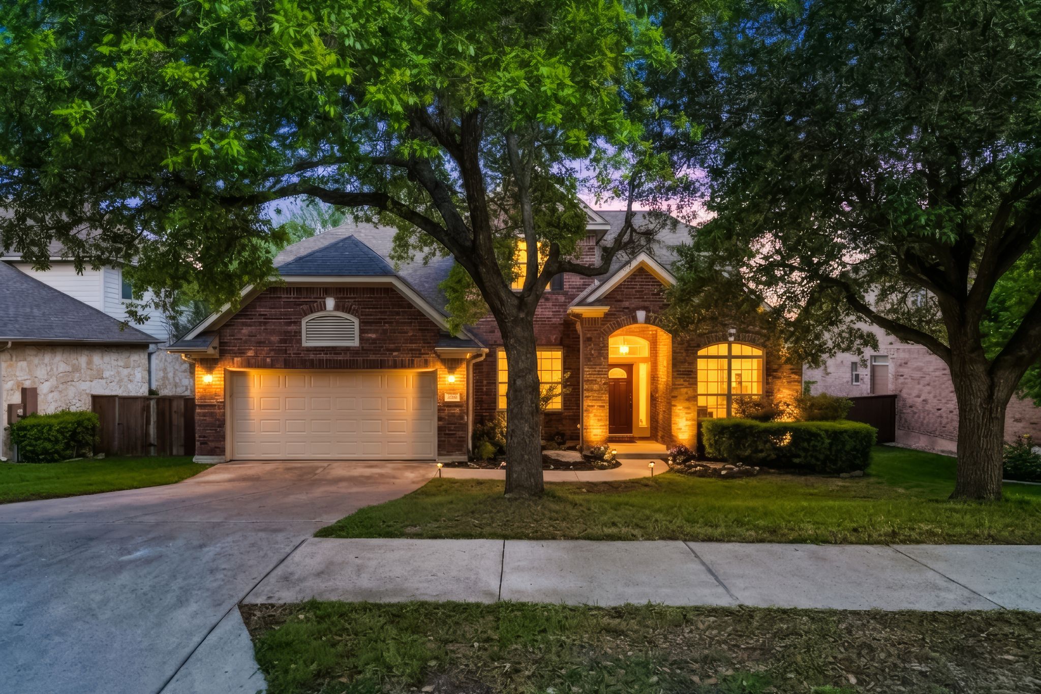 2708 Rio Mesa Drive Austin, TX 78732 - Photo 40 of 40 a front view of a house with garden