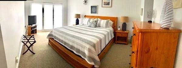 223 Sandpiper Lane Tisbury, MA 02568 - Photo 14 of 17 a bed room with a bed and a night stand