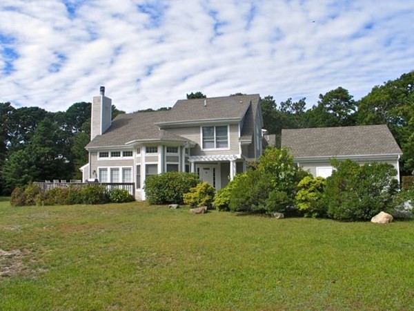 223 Sandpiper Lane Tisbury, MA 02568 - Photo 17 of 17 a front view of a house with a yard