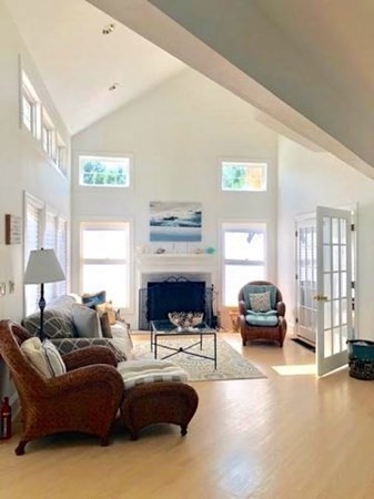223 Sandpiper Lane Tisbury, MA 02568 - Photo 3 of 17 a living room with furniture fireplace and a window