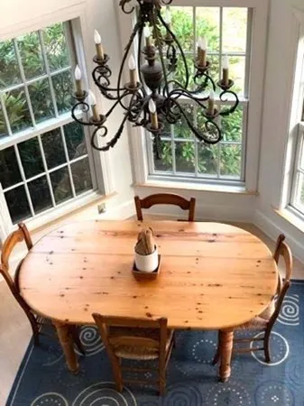 a view of a dining room with furniture window and outside view