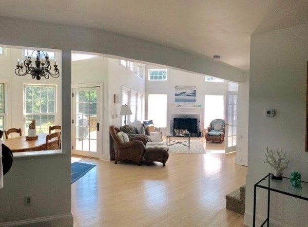 223 Sandpiper Lane Tisbury, MA 02568 - Photo 10 of 17 a living room with furniture and a fireplace