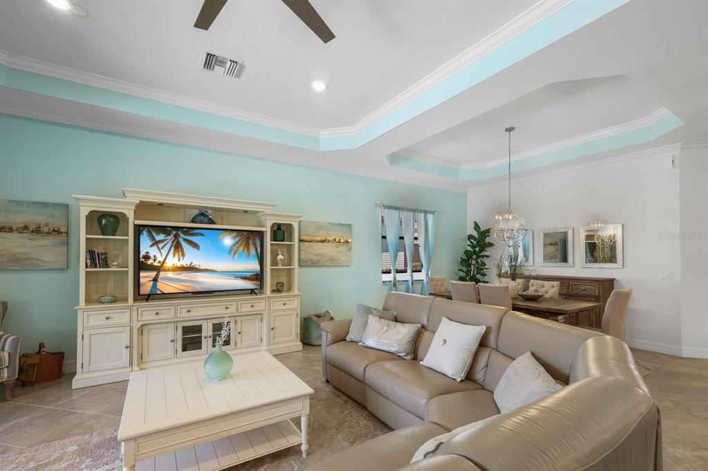 6036 Cessna Run Bradenton, FL 34211 - Photo 16 of 75 a living room with furniture and a flat screen tv
