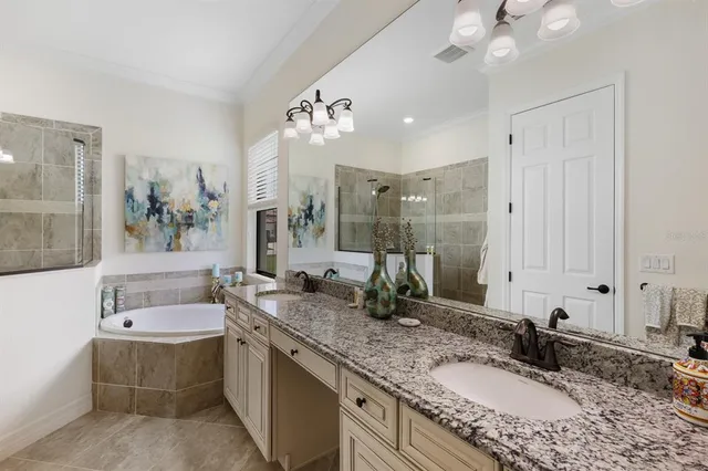 a living room with flat screen tv a lamp and a flat screen tv