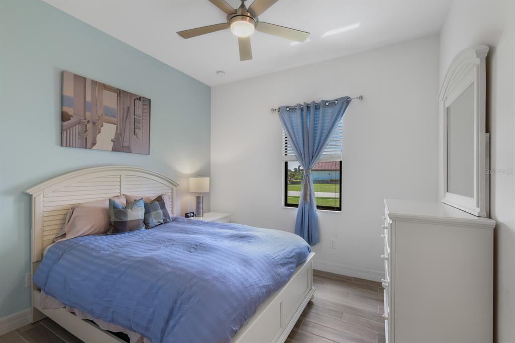 6036 Cessna Run Bradenton, FL 34211 - Photo 29 of 75 a bedroom with a bed and a window