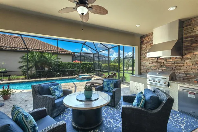 front view of a house with a yard and palm trees