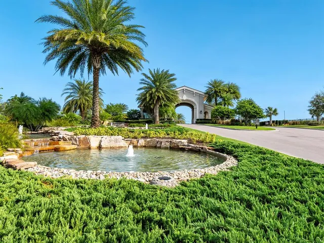 a view of swimming pool with a garden and trees