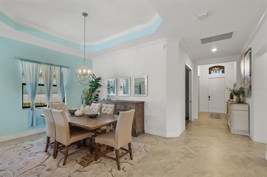 6036 Cessna Run Bradenton, FL 34211 - Photo 8 of 75 a view of a dining room with furniture window and wooden floor