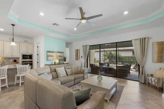 a kitchen with stainless steel appliances granite countertop a sink refrigerator and cabinets