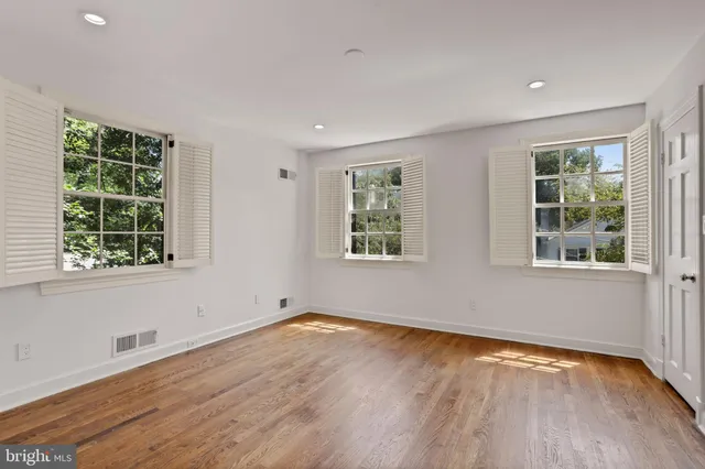 a view of a livingroom with wooden floor