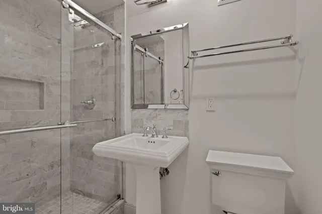 a utility room with cabinets washer and dryer