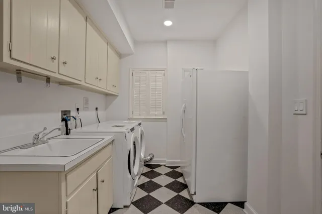 a view of empty room with white walls