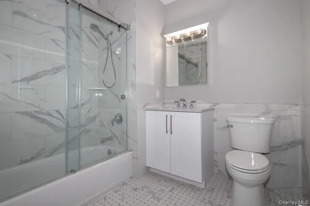 a bathroom with a shower a toilet and sink