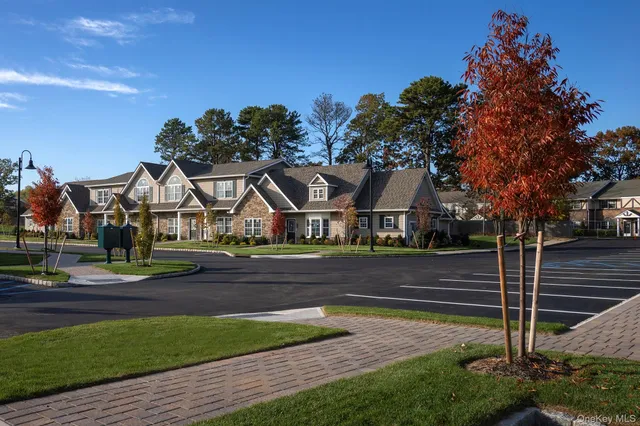 a view of house with a yard