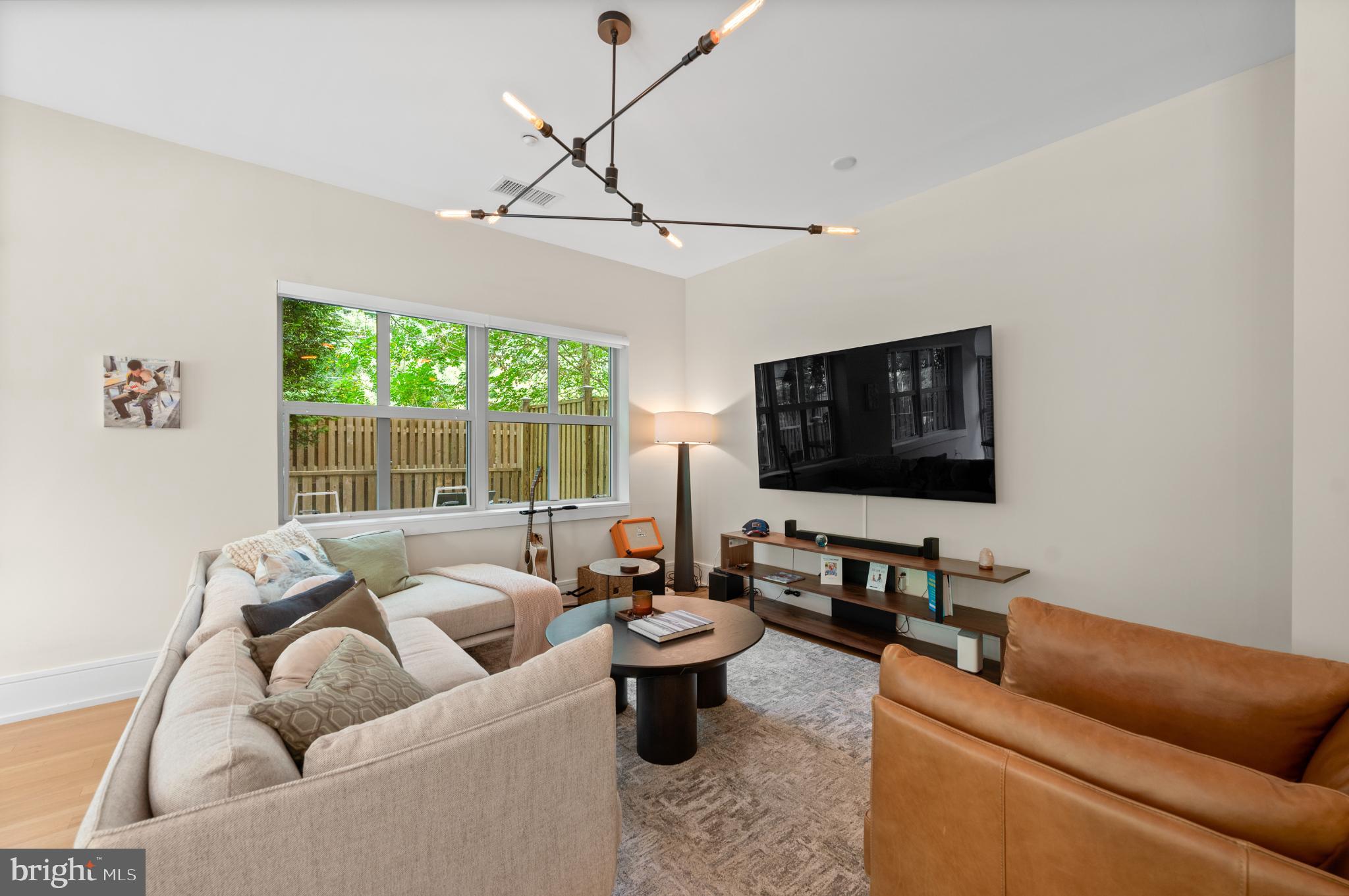 112 Iron Works Way Wayne, PA 19087 - Photo 11 of 50 a living room with furniture and a flat screen tv