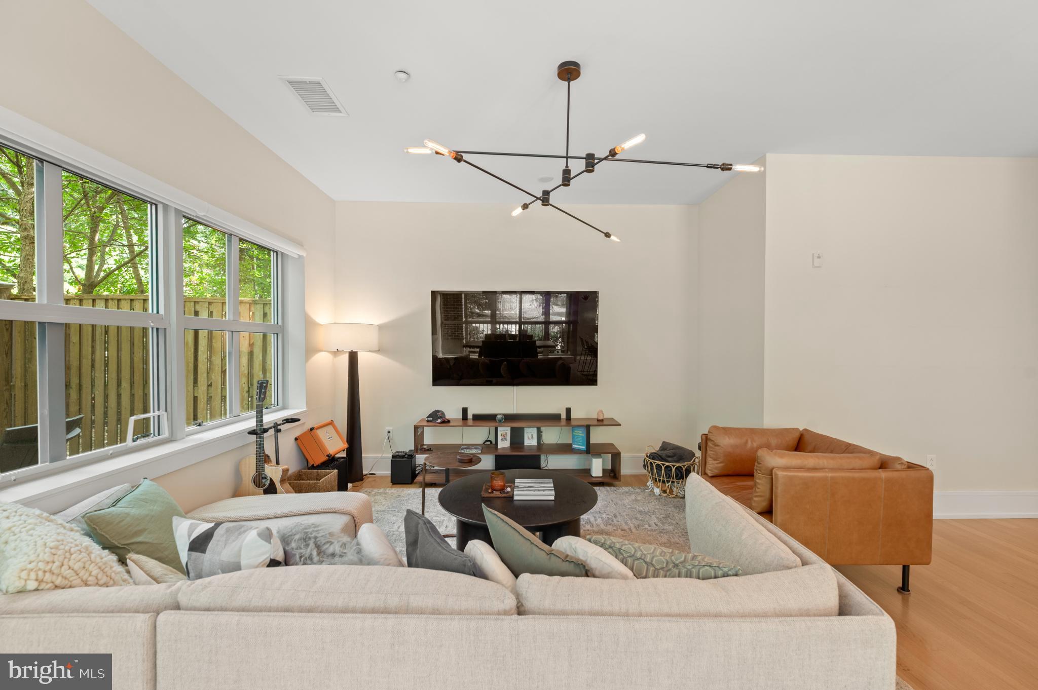 112 Iron Works Way Wayne, PA 19087 - Photo 12 of 50 a living room with furniture and a flat screen tv