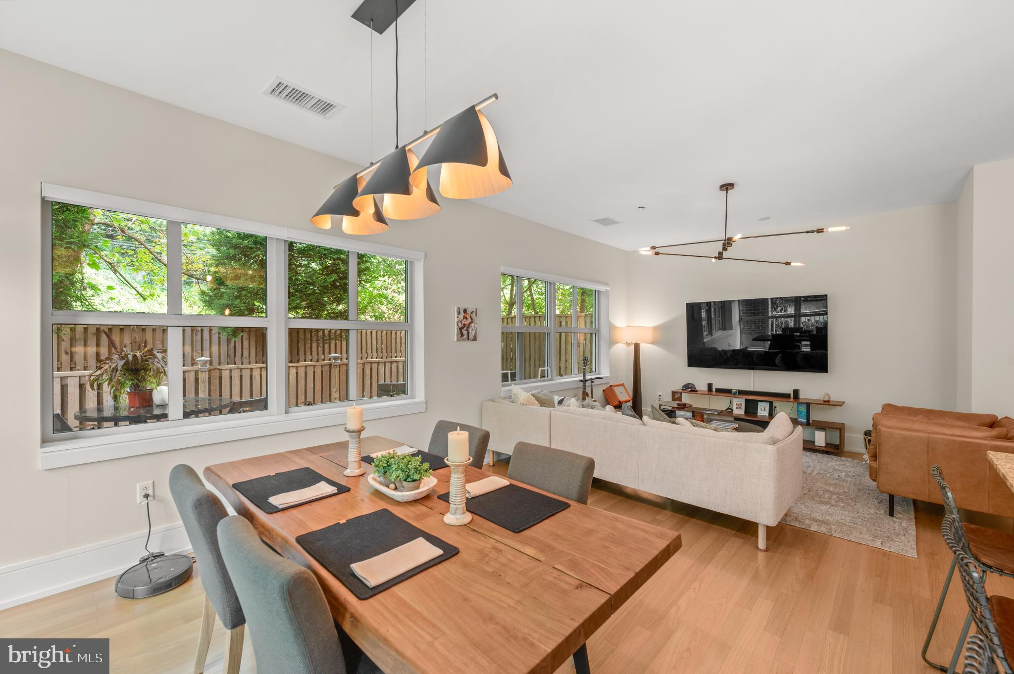 112 Iron Works Way Wayne, PA 19087 - Photo 17 of 50 a living room with furniture a flat screen tv and a large window