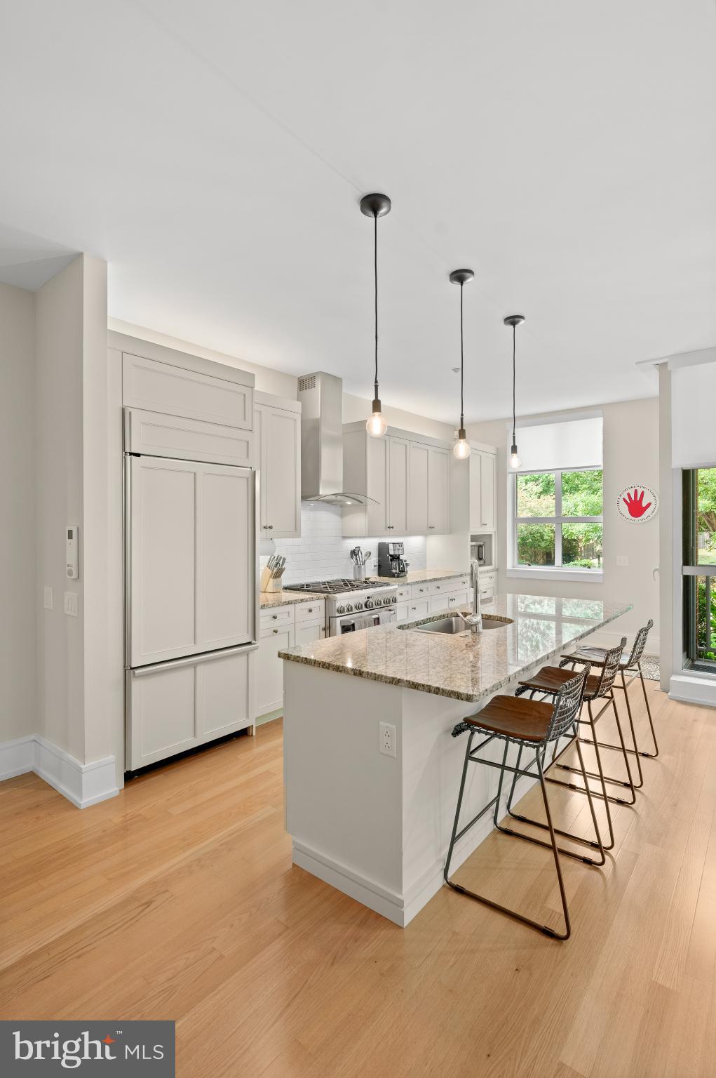 112 Iron Works Way Wayne, PA 19087 - Photo 22 of 50 a kitchen with stainless steel appliances granite countertop a sink a stove a refrigerator and white cabinets