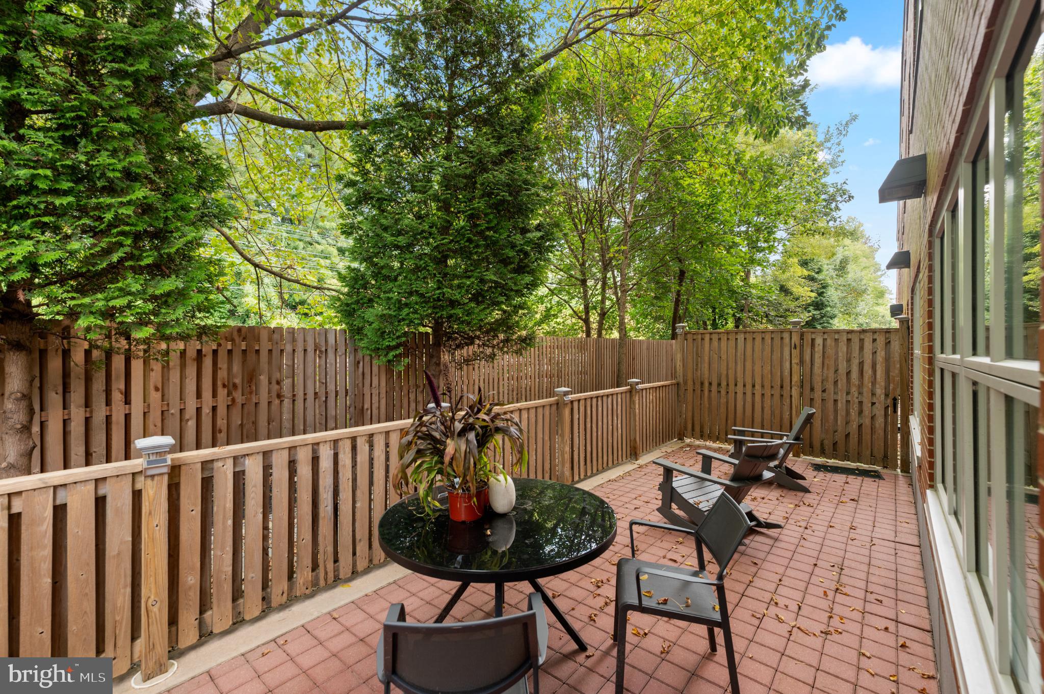112 Iron Works Way Wayne, PA 19087 - Photo 27 of 50 a view of a chairs and tables in the back yard of the house