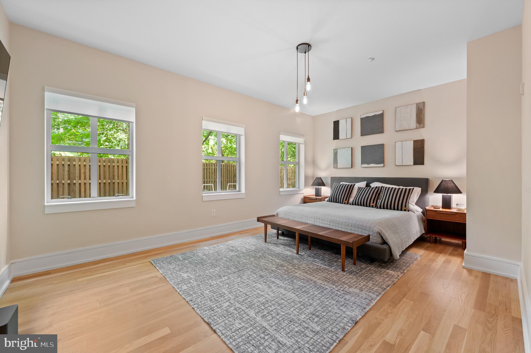 112 Iron Works Way Wayne, PA 19087 - Photo 35 of 50 a spacious bedroom with a bed wooden floor and window