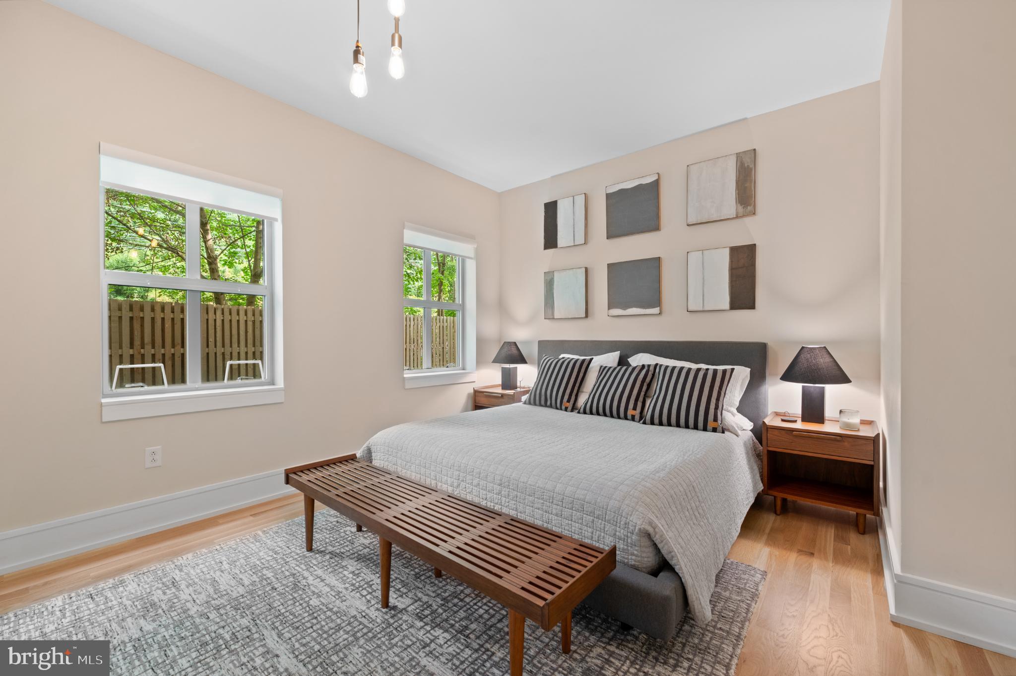 112 Iron Works Way Wayne, PA 19087 - Photo 37 of 50 a bedroom with a bed wooden floor and window