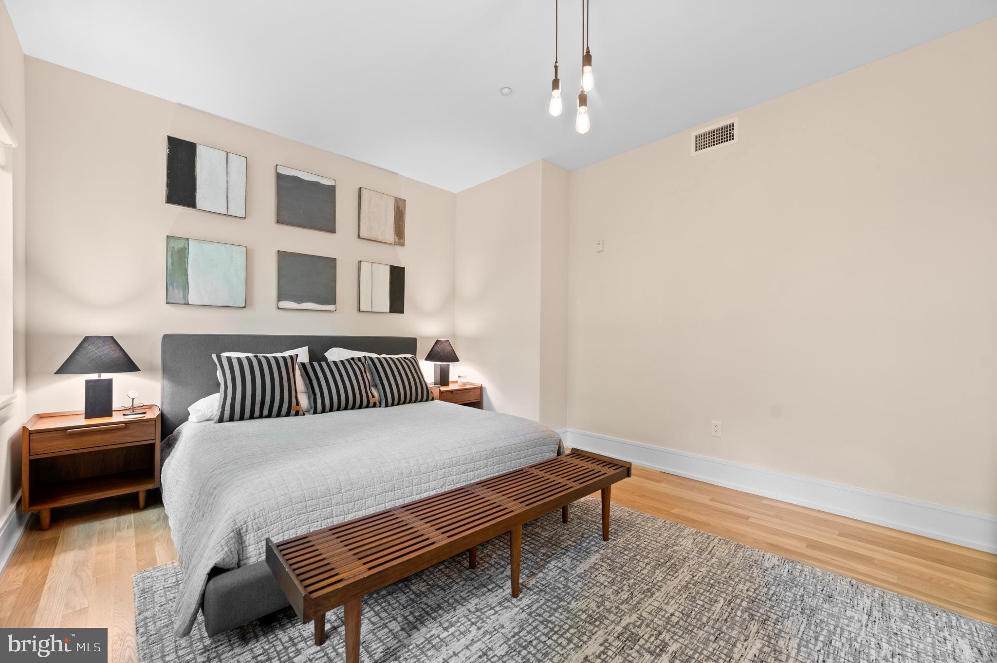 112 Iron Works Way Wayne, PA 19087 - Photo 38 of 50 a bedroom with a bed and wooden floor