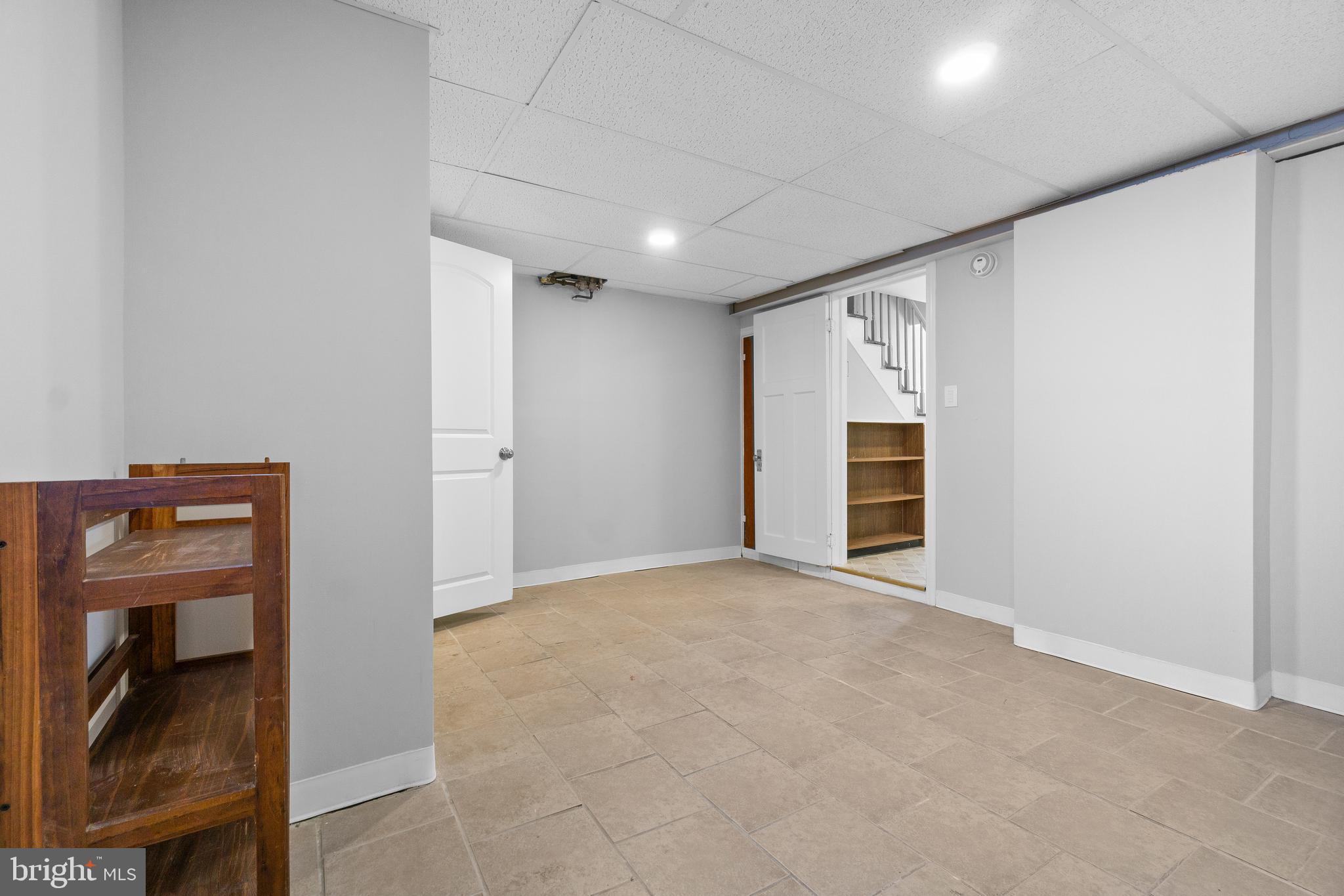 3572 Juneway, Unit 1 Baltimore, MD 21213 - Photo 11 of 23 a view of an empty room with a fireplace