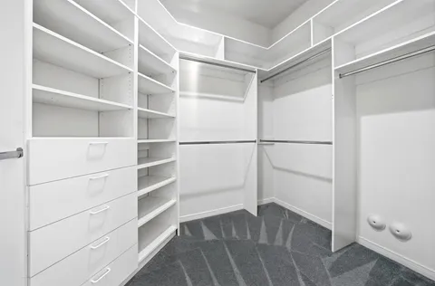 a view of an empty walk in closet