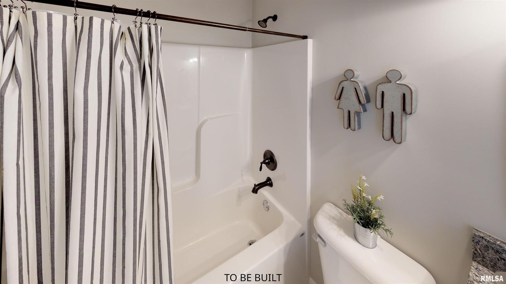 6 South 5th Street Eldridge, IA 52748 - Photo 13 of 17 a bathroom with a shower curtain